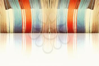 Multicolored threads with reflection taken closeup as abstract background.