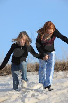 2 Young Girls Playing in the Snow Canada
