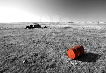 Old Barrell and Abandoned Car in Field