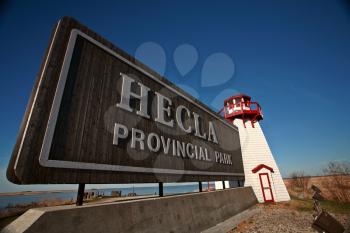 Model lighthouse and sign on Hecla Island in Manitoba