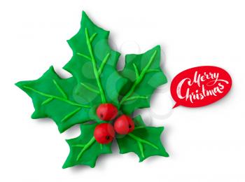 Hand made plasticine figure of Christmas Holly with greeting banner and shadow on white background.