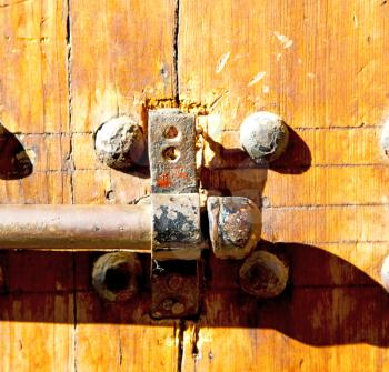 brown    morocco in    africa the old wood  facade home and rusty safe padlock 