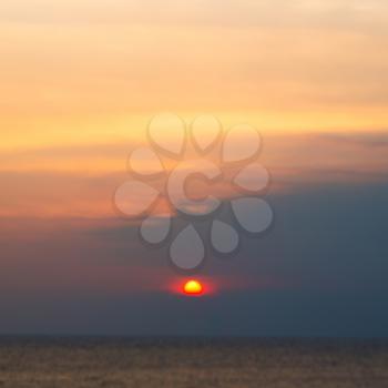  the blurred  sun falling down arabian sea ocean  in oman coastline