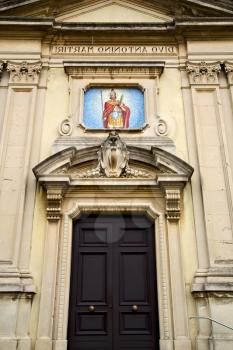 church caiello gallarate varese italy the old door entrance and mosaic