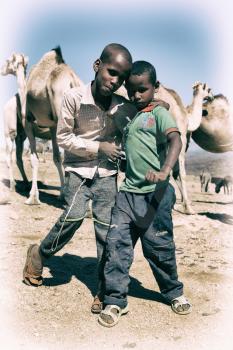 ETHIOPIA,BABILE-CIRCA  JANUARY 2018--unidentified    young boys in the camels market 
