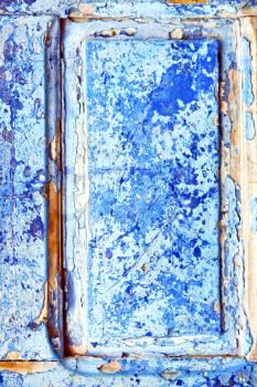 
nail stripped paint in the blue wood door and rusty 
