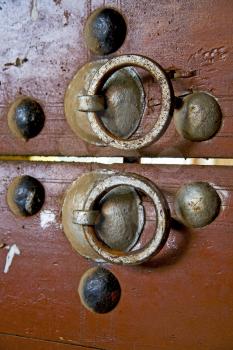 brown  morocco in africa the old wood  facade home and rusty safe padlock 