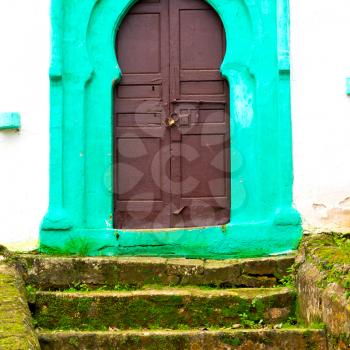 olddoor in morocco  africa ancien and wall ornate brown green