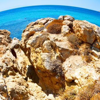 in greece the mykonos island rock sea and beach    sky