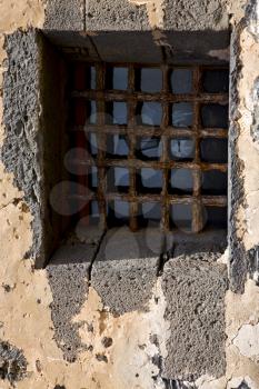 brown distorted  castle window in a broke   wall arrecife lanzarote spain

