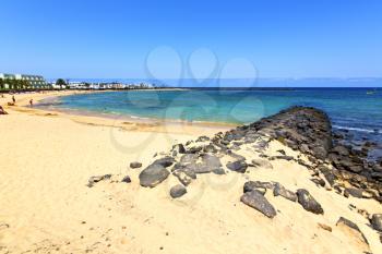 white coast lanzarote  in spain   beach  stone water  and summer 