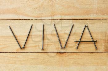 VIVA word on the shield of wooden boards is composed with nails 