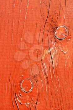 Detail of shelled wooden desk painted in bright red