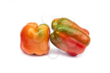 Two sweet pepper fruits on a white background