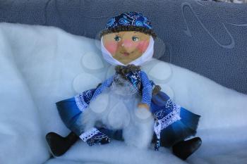 Russian homemade rag doll as symbol of winter