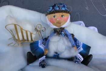 Russian homemade rag doll as symbol of winter
