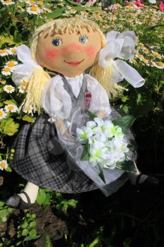 Russian homemade rag doll as symbol of schoolgirl