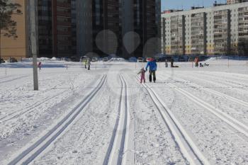 NOVOSIBIRSK MARCH 11,2017: Young girl skiing on ski track