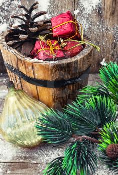 wooden tub with pine cones and Christmas decorations and ornaments.Selective focus