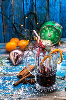  glass of mulled wine on the background of Christmas decorations.Selective focus