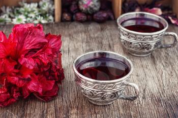 Medicinal tea decoction of hibiscus tea in stylish cups.