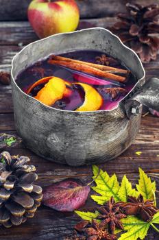 retro pot with mulled wine in the autumn still life
