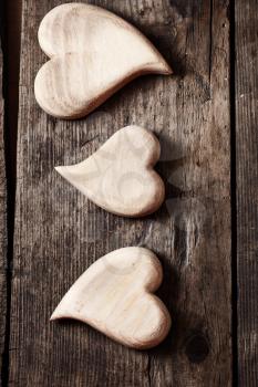 Wooden hearts handmade holiday Valentine's Day on a vintage wooden background