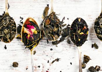 Leaf tea of different varieties in spoons.Top view