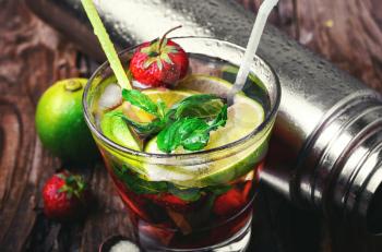 Popular cocktail with lime,mint and strawberries