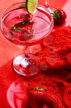 Martini glass with strawberries and red lace
