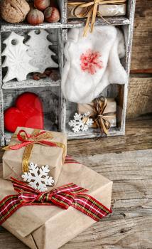 Wooden box with Christmas symbols and boxes gifts
