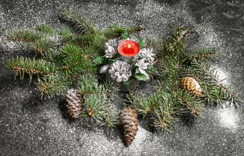 Spruce branches with pinecones and Christmas ornaments