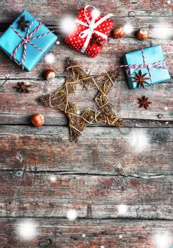 Three boxes with Christmas gifts on retro wooden background
