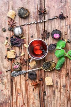 Cup of tea,dry tea leaves of different varieties and spices