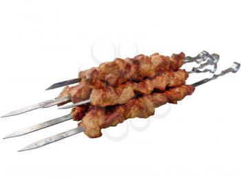 The shish kebab on skewers isolated on the white background