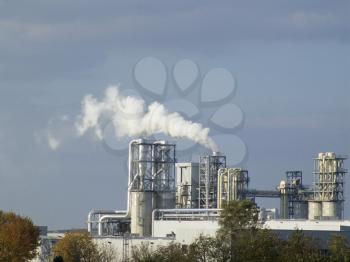 Ecological pollution by a white smoke from a factory pipe