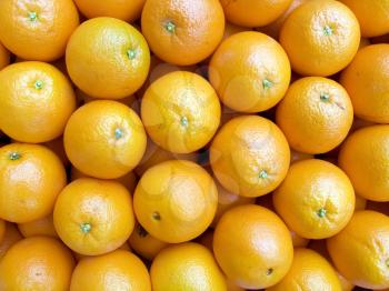 The beautiful oranges on a counter, fruit background