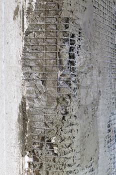 Old wall reinforcement repair. Concrete architecture lattice construction