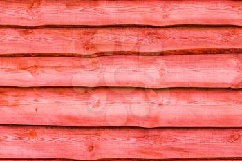 Red wooden boards background. Wall floor or fence exterior design. Natural wood material backdrop