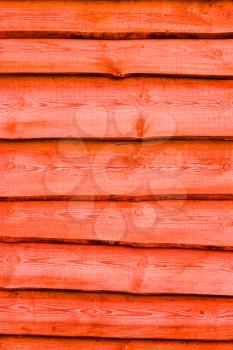 Red wooden boards vertical background. Wall floor or fence exterior design. Natural wood material backdrop