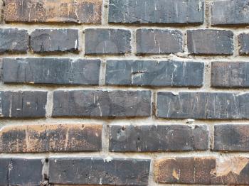 Black brick wall texture background pattern. Dark brickwork aged textured backdrop