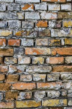 Old brick wall vertical backdrop. Architecture facade texture. House interior background
