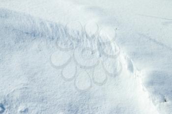 Winter snowdrift cover sunny day. Fresh snowdrift backdrop. Snowy covered landscape. Ice snowflake texture