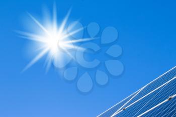 Sun solar panels and blue sky. Sunlight clean energy power. Renewable green cheap electricity