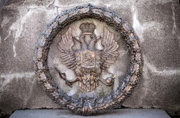 Double Eagle - Emblem of Russia. Fragment of old monument