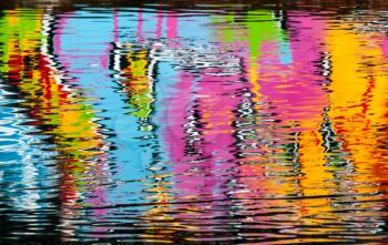 Abstract colorful graffiti reflection in the river water
