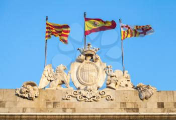Flags of Catalonia, Spain and Barcelona city on the rooftop