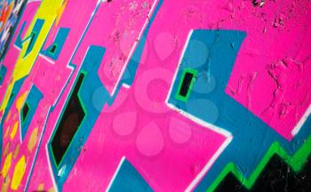 Abstract colorful graffiti fragment over old concrete wall