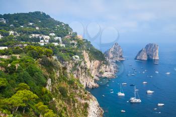 Mediterranean Sea coastal landscape with Faraglioni rocks of Capri island, Italy