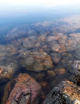 Coastal stones under still clear water on Saimaa lake,  Imatra town, Finland